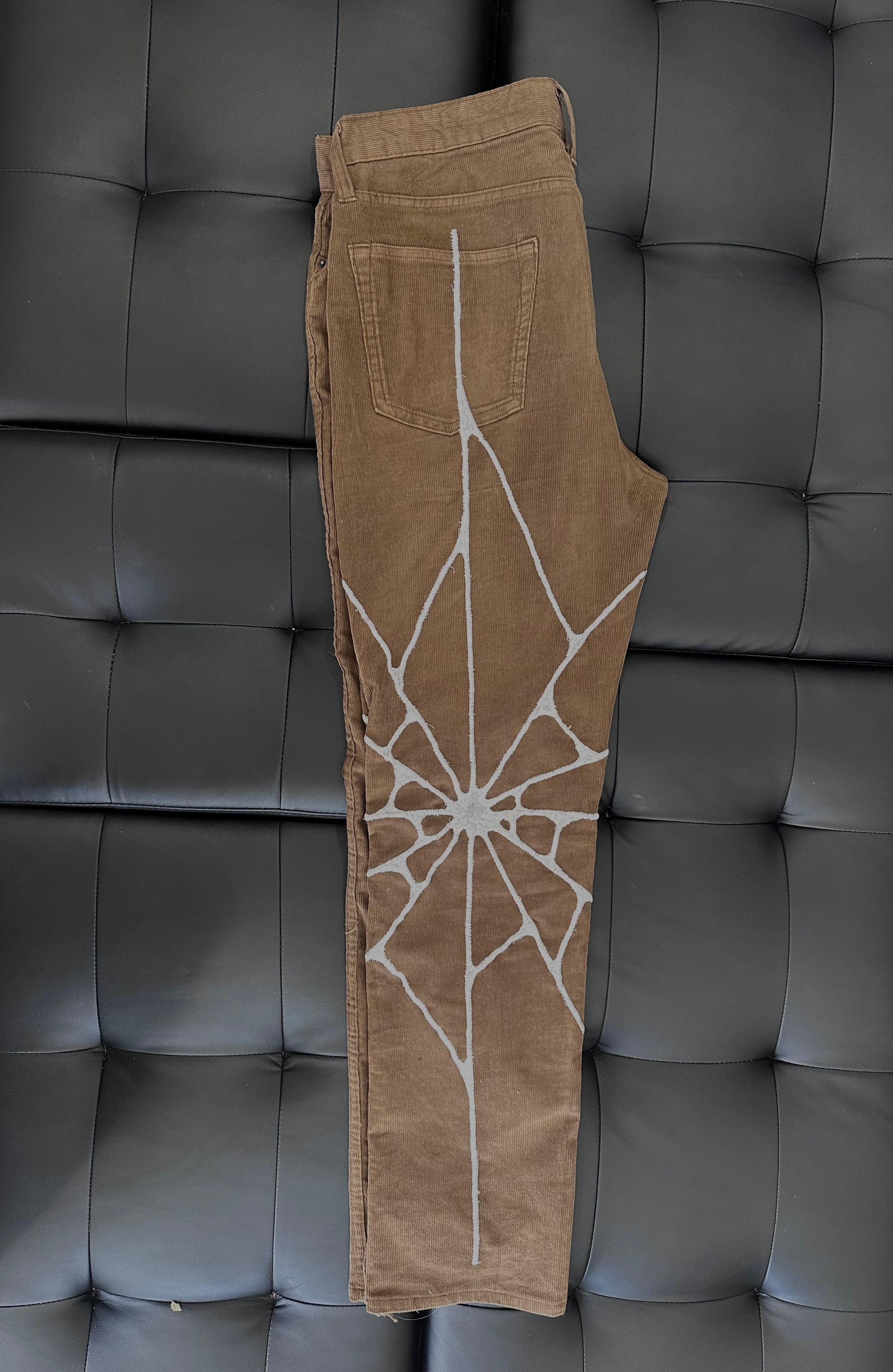 Brown corduroy with whvte web embroidered