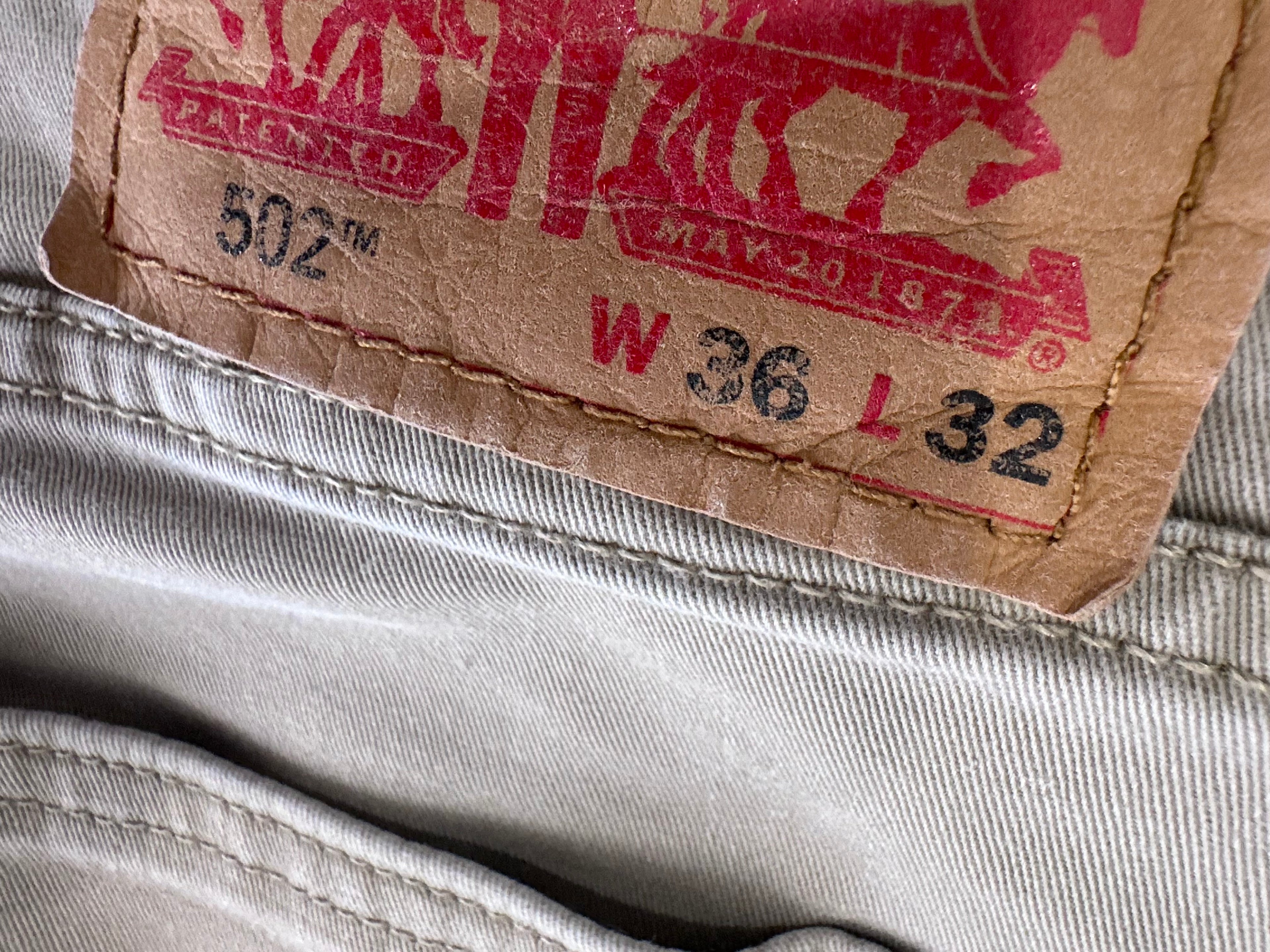 Khaki Levi jeans with w khaki web embroidered