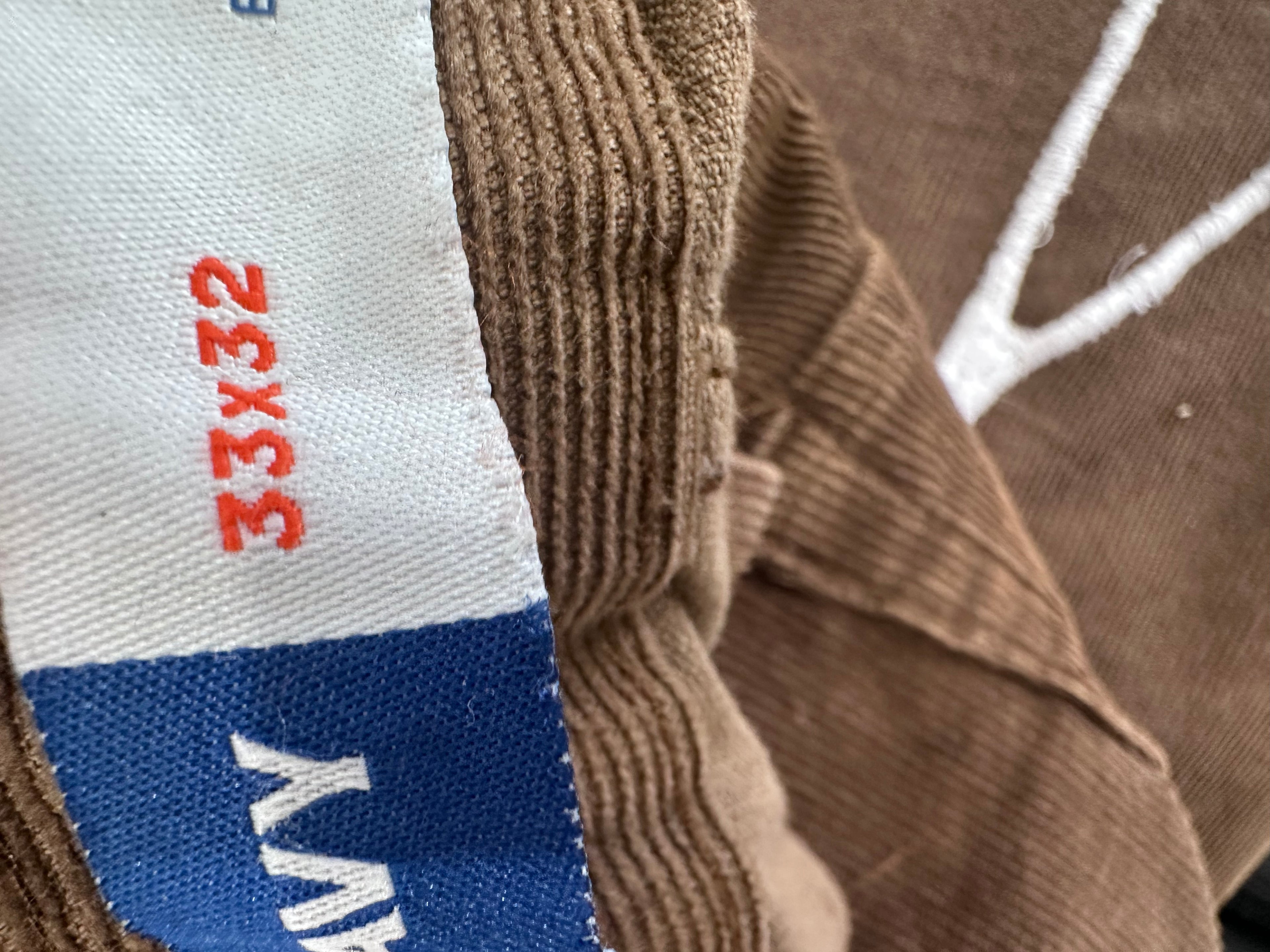 Brown corduroy with whvte web embroidered