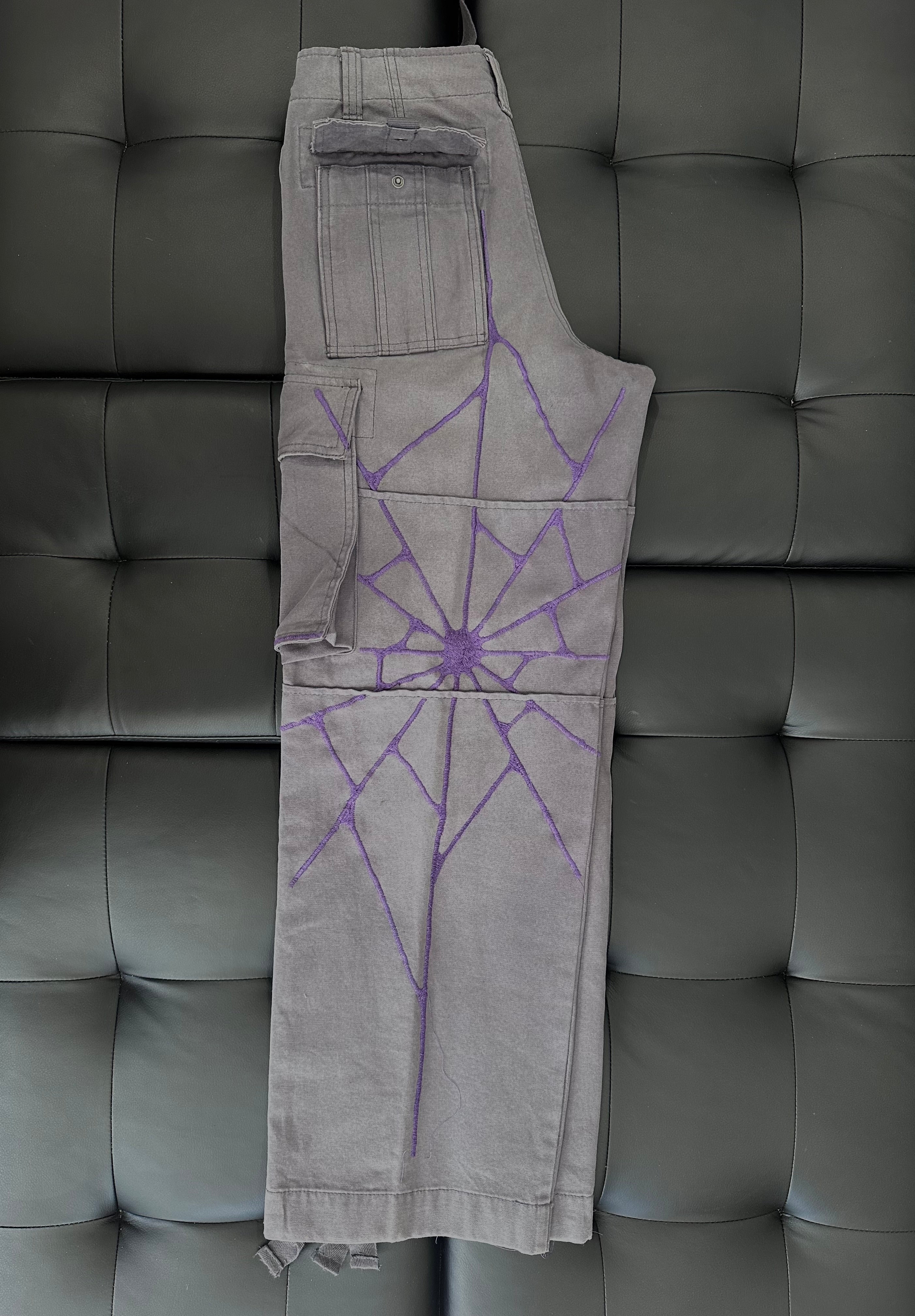 Grey panel cargos with an embroidered purple web