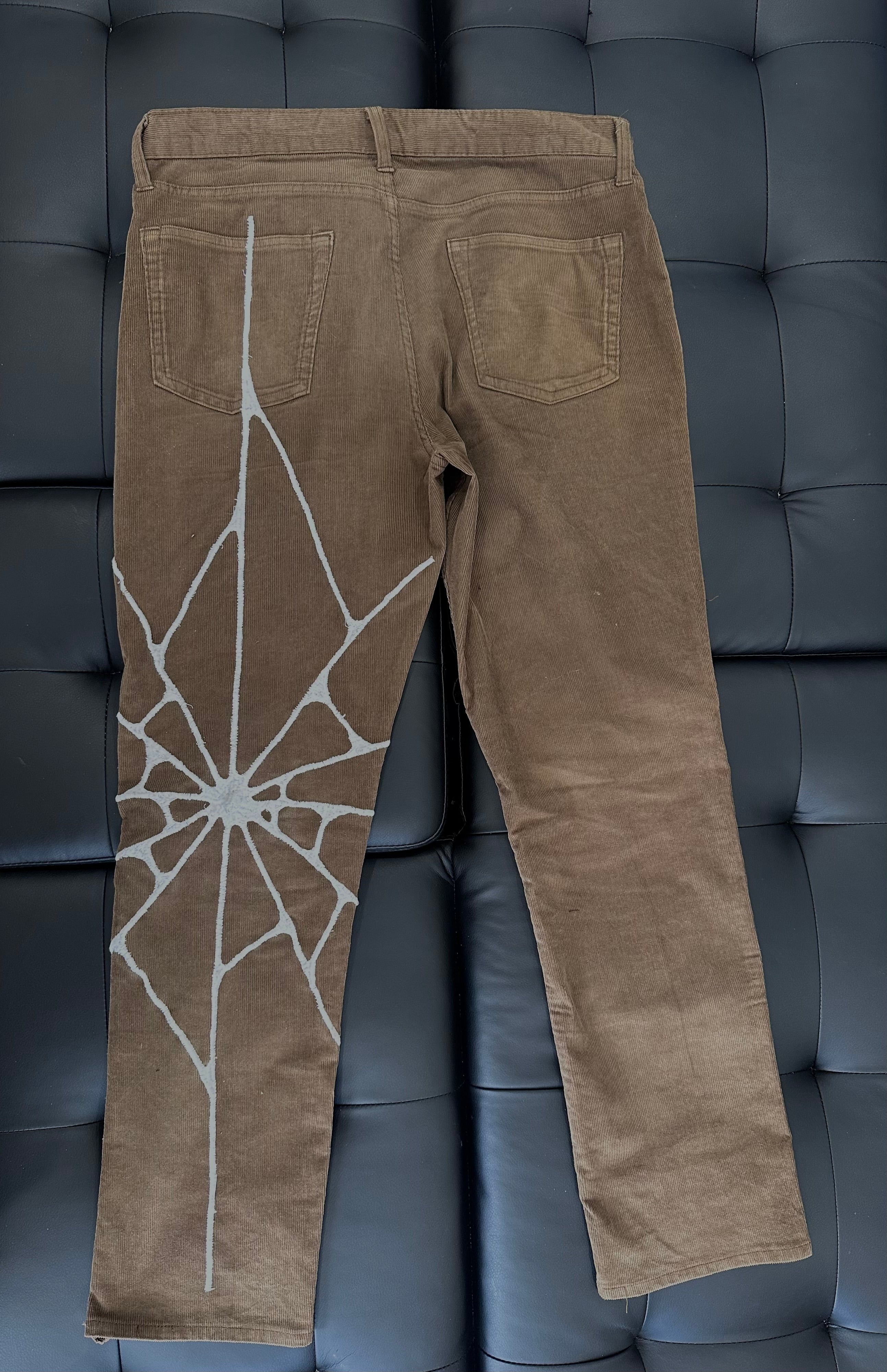 Brown corduroy with whvte web embroidered