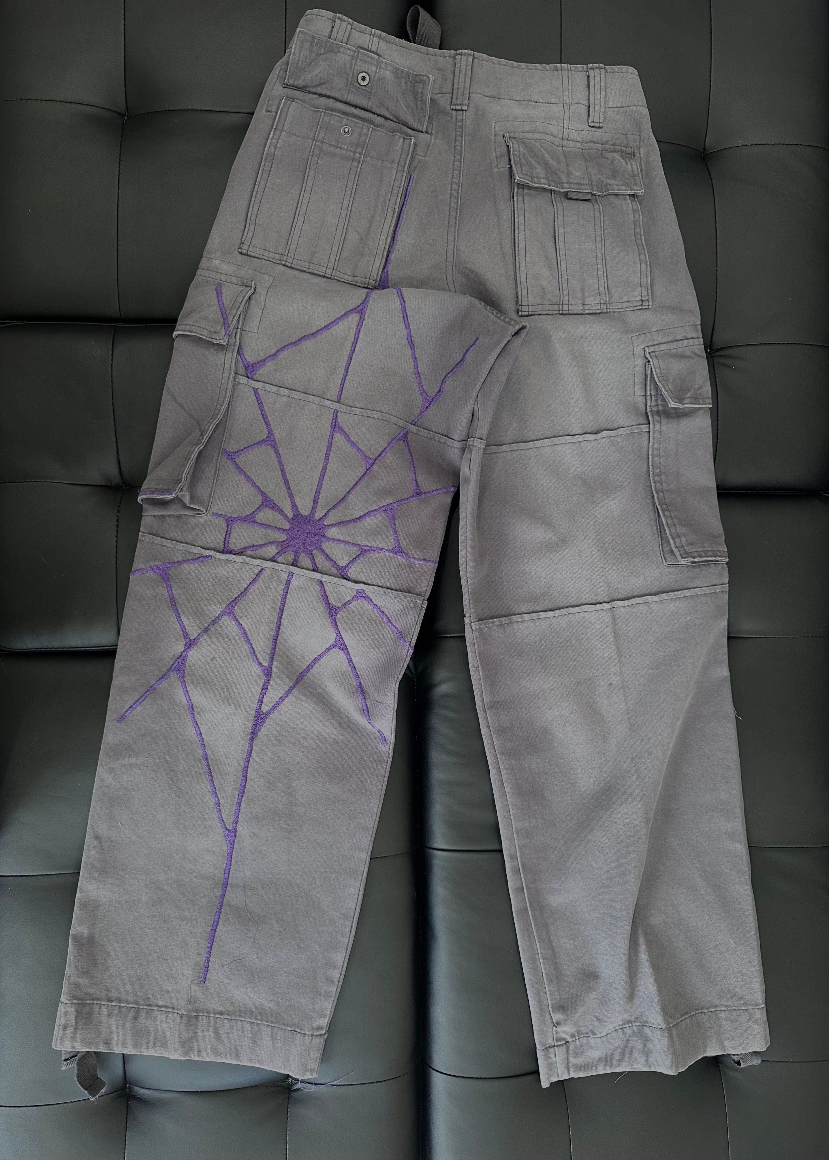 Grey panel cargos with an embroidered purple web