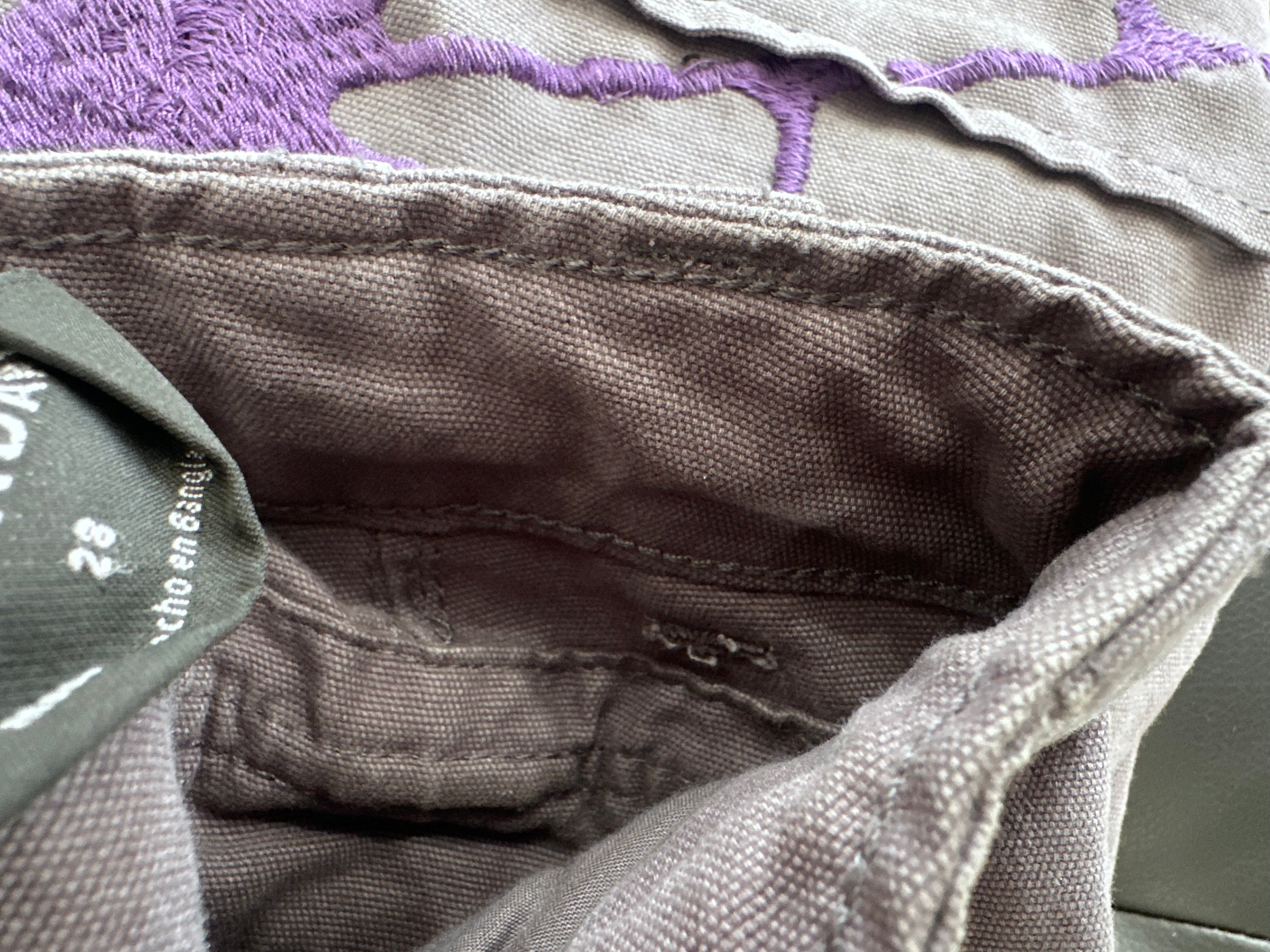 Grey panel cargos with an embroidered purple web
